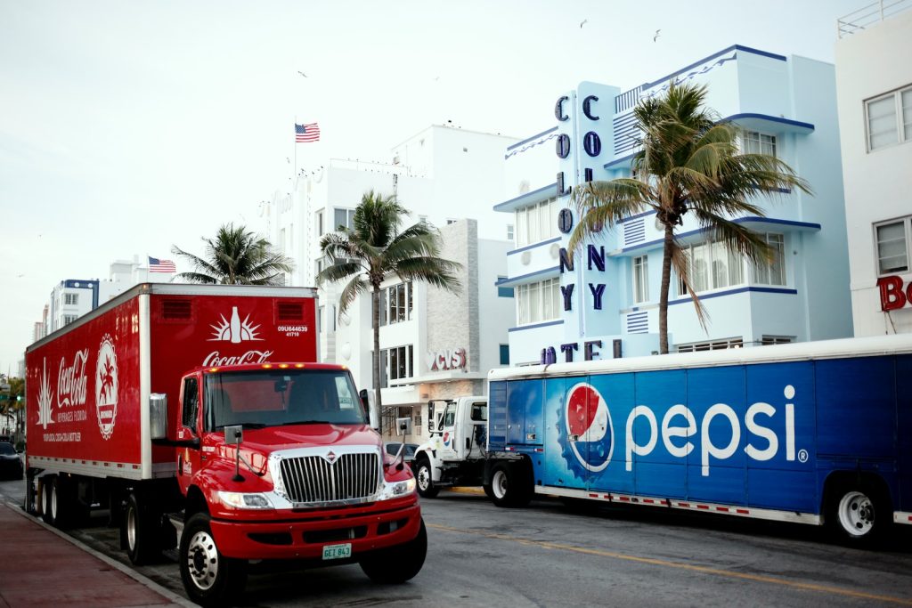red and white ford truck on road during daytime