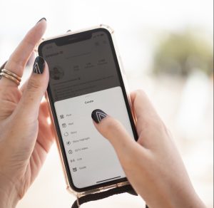 a person holding a cell phone in their hand
